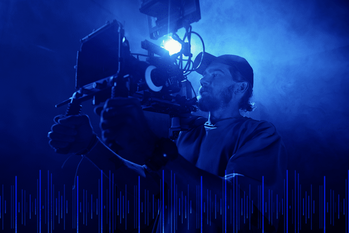 A man is recording something using a video camera