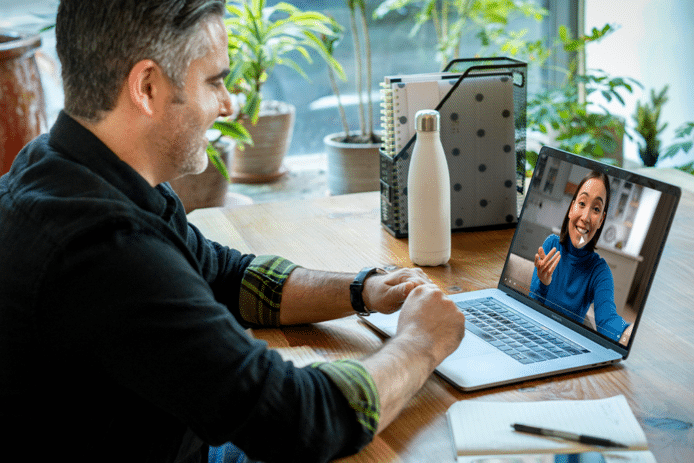 A man chatting with a woman on video call