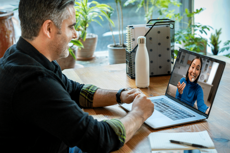 A man chatting with a woman on video call