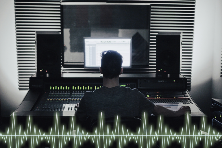 A man doing a transcription job while sitting in front of a big screen