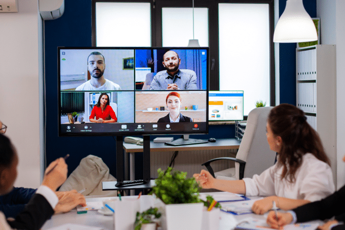 Doing a video conference with the office team for a transcription job